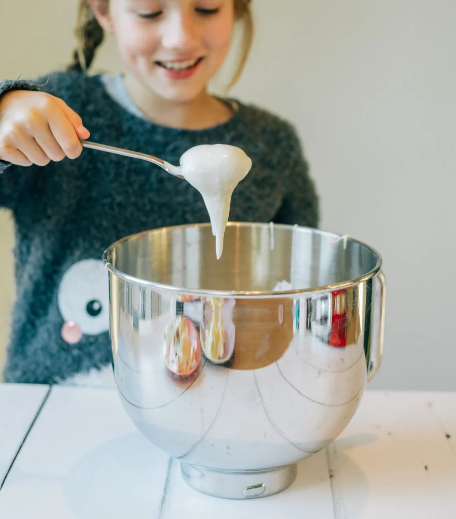 child making meringue to learn about kitchen science