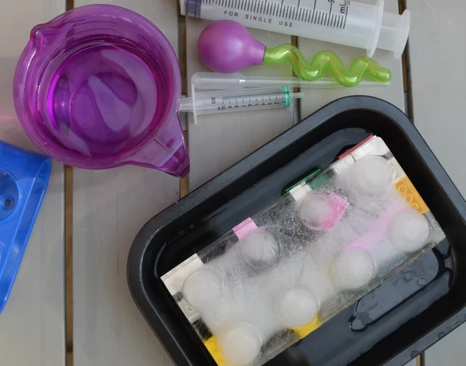 Frozen ice block with toys inside